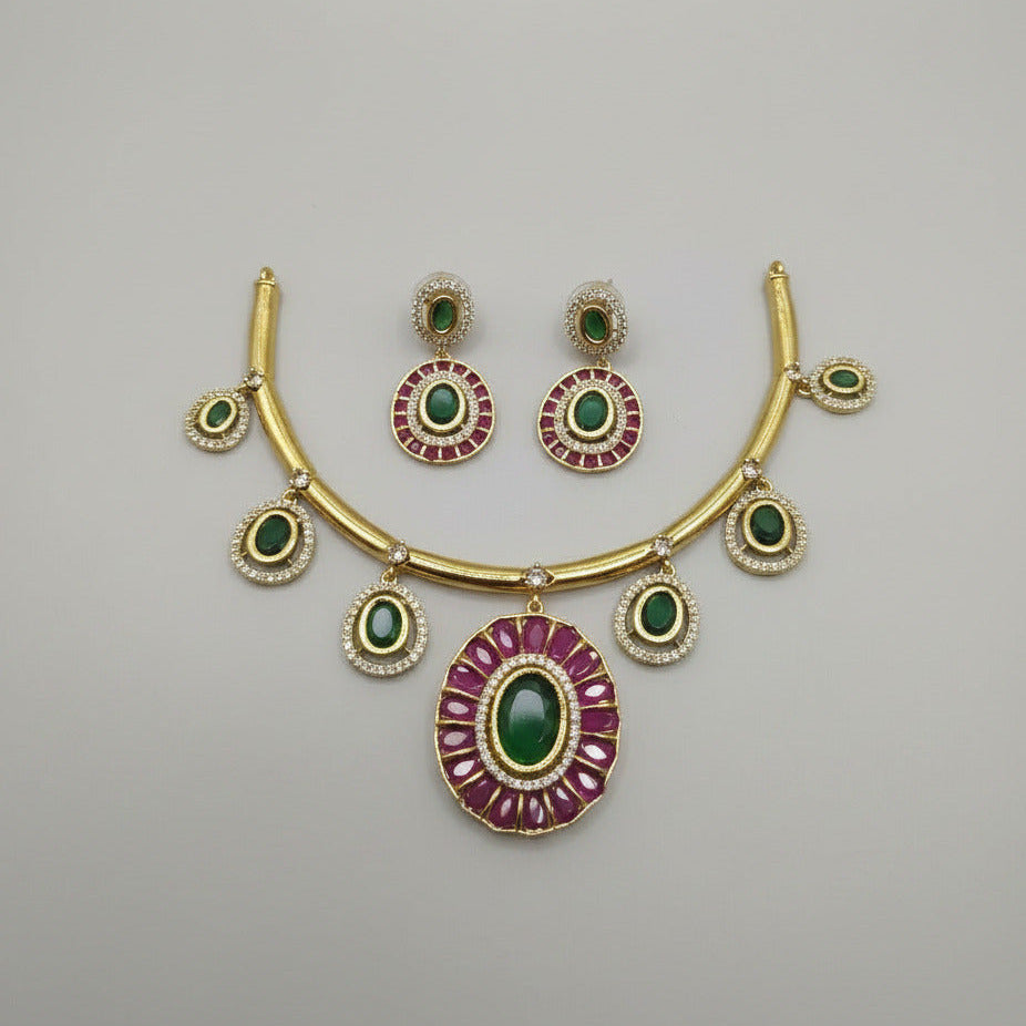 Decorative brooch with gemstones on a white fabric background next to a yellow box with 'Vediha' branding.